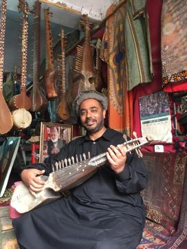 The author playing an antique Afghan lute