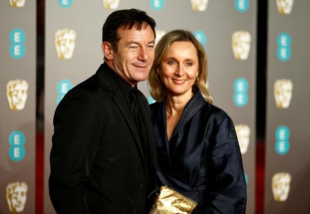 Jason Isaacs (L) and Emma Hewitt arrive at the British Academy of Film and Television Awards (BAFTA) at the Royal Albert Hall in London, Britain. (REUTERS) Jason Isaacs (L) and Emma Hewitt arrive at the British Academy of Film and Television Awards (BAFTA) at the Royal Albert Hall in London, Britain. (REUTERS)