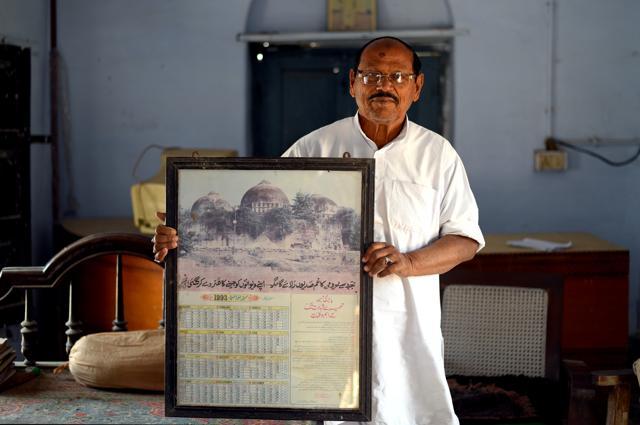 Sabir Ali, a retired government official, with a framed Babri Masjid calendar at his residence in Ayodhya. (Amal KS/HT PHOTO) Sabir Ali, a retired government official, with a framed Babri Masjid calendar at his residence in Ayodhya. (Amal KS/HT PHOTO)