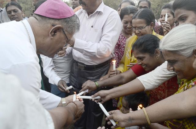 At least 200 people from various communities were present for the candle light vigil. (Ravindra Joshi/HT PHOTO)