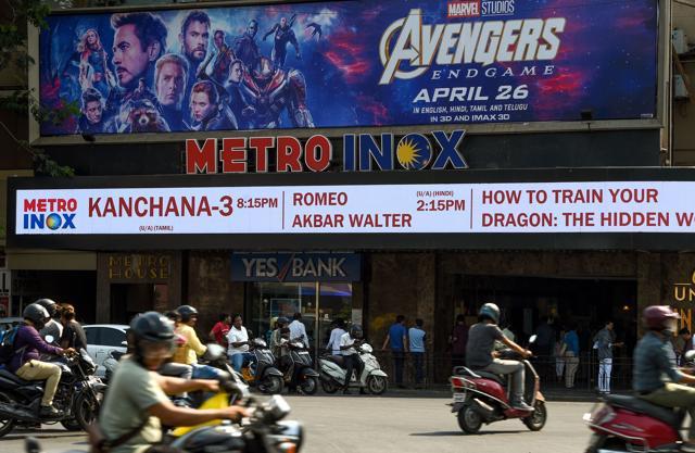 Vehicles go past a movie theatre displaying a poster of the latest Avengers movie, in Mumbai. (AFP)