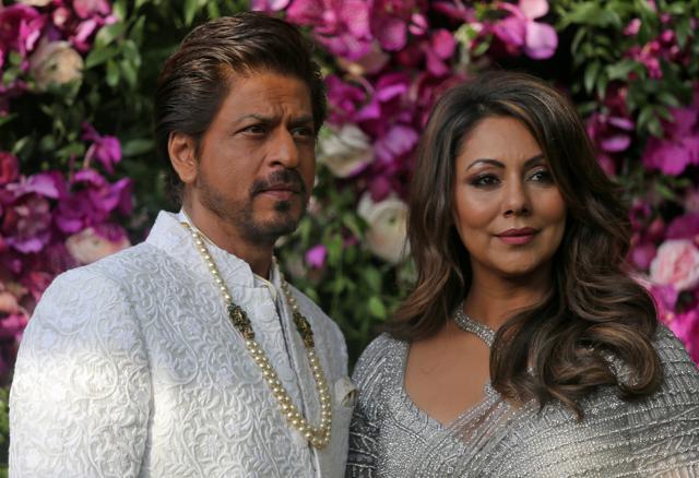 Bollywood actor Shah Rukh Khan and his wife Gauri pose during a photo opportunity at the wedding ceremony of Akash Ambani, son of the Chairman of Reliance Industries Mukesh Ambani. (REUTERS) Bollywood actor Shah Rukh Khan and his wife Gauri pose during a photo opportunity at the wedding ceremony of Akash Ambani, son of the Chairman of Reliance Industries Mukesh Ambani. (REUTERS)