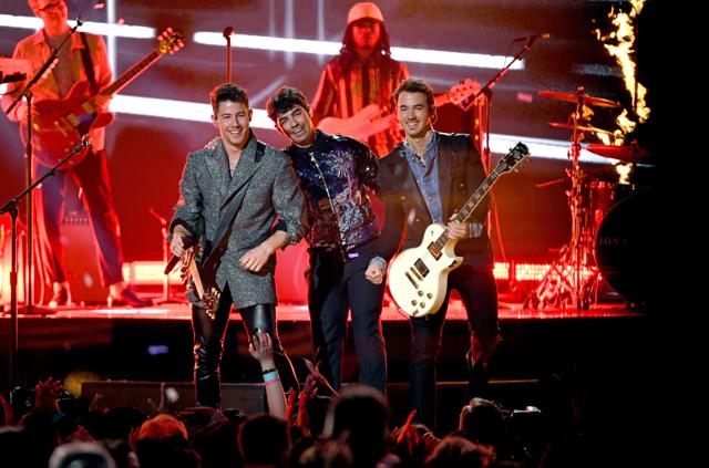Priyanka Chopra and Sophie Turner cheered as Nick Jonas, Joe Jonas, and Kevin Jonas performed onstage during the 2019 Billboard Music Awards. (AFP) Priyanka Chopra and Sophie Turner cheered as Nick Jonas, Joe Jonas, and Kevin Jonas performed onstage during the 2019 Billboard Music Awards. (AFP)