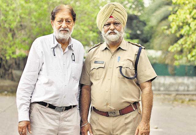 Fire station head Avtar Singh with owner of the factory, Shyam Lal Arora. (Shivam Saxena/Hindustan Times)