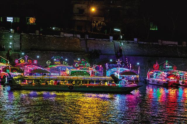 Colourfully-decked cruise boats on the river Nile, which is the lifeline of Egypt