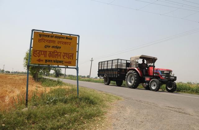 A tractor moves past a road, at Kunal village, in Ratia tehsil of Fatehabad district, in Haryana. (Parveen Kumar / HT Photo ) A tractor moves past a road, at Kunal village, in Ratia tehsil of Fatehabad district, in Haryana. (Parveen Kumar / HT Photo )