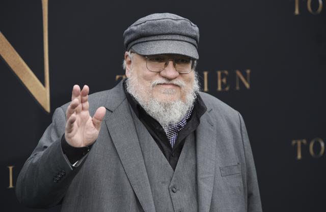 Author George RR Martin waves to photographers at the premiere of the film Tolkien, at the Regency Village Theatre, Wednesday. (Chris Pizzello/Invision/AP) Author George RR Martin waves to photographers at the premiere of the film Tolkien, at the Regency Village Theatre, Wednesday. (Chris Pizzello/Invision/AP)
