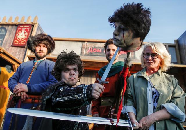 An actor dressed as Tyrion Lannister, poses for photographers with fake severed head before the screening of final episode of Game of Thrones on 20-meter-high screen at RZD Arena in Moscow, Russia May 20. (REUTERS) An actor dressed as Tyrion Lannister, poses for photographers with fake severed head before the screening of final episode of Game of Thrones on 20-meter-high screen at RZD Arena in Moscow, Russia May 20. (REUTERS)