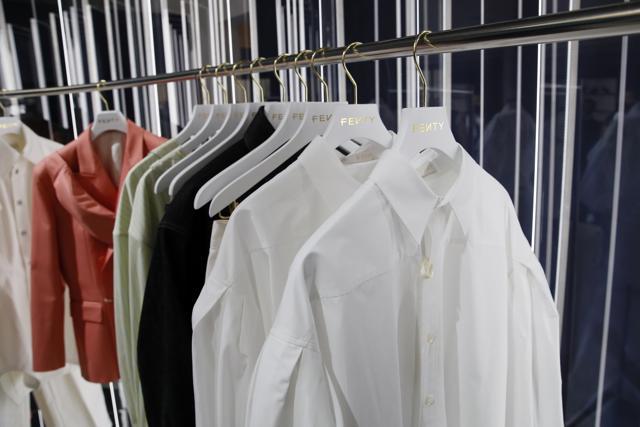 Designs are displayed as Rihanna unveils her first fashion designs for Fenty at a pop-up store in Paris, France, Wednesday, May 22, 2019. Singer Rihanna is the first black woman in history to head up a major Parisian luxury house, and the collection, named after the singer turned designer's last name, comprises of ready-to-wear, footwear, accessories, and eyewear and is available for sale Paris' Le Marais area from Friday and will debut online May 29. (AP Photo/Francois Mori) (AP)