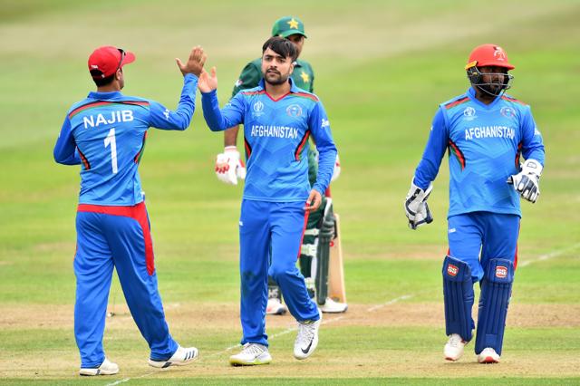 Afghanistan's Rashid Khan (C) celebrates with Afghanistan's Najibullah Zadran (L) after taking the wicket of Pakistan's captain Sarfaraz Ahmed for 13 during the 2019 Cricket World Cup warm up match. (AFP) Afghanistan's Rashid Khan (C) celebrates with Afghanistan's Najibullah Zadran (L) after taking the wicket of Pakistan's captain Sarfaraz Ahmed for 13 during the 2019 Cricket World Cup warm up match. (AFP)