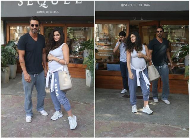 Arjun Rampal and Gabriella Demetriades outside a restaurant.