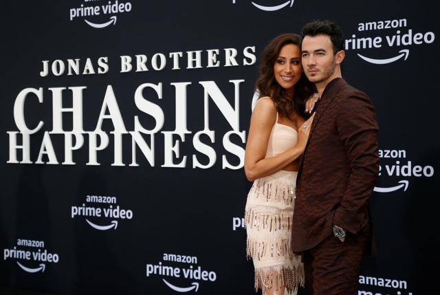 Danielle and Kevin Jonas arrive at the premiere for the documentary Chasing Happiness. (REUTERS) Danielle and Kevin Jonas arrive at the premiere for the documentary Chasing Happiness. (REUTERS)