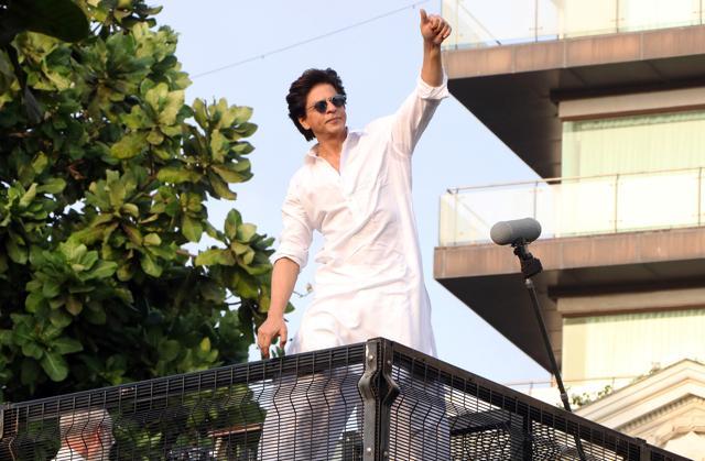 Actor Shah Rukh Khan greets his fans on the occasion of Eid-al-Fitr at his residence Mannat in Mumbai on Wednesday. Actor Shah Rukh Khan greets his fans on the occasion of Eid-al-Fitr at his residence Mannat in Mumbai on Wednesday.