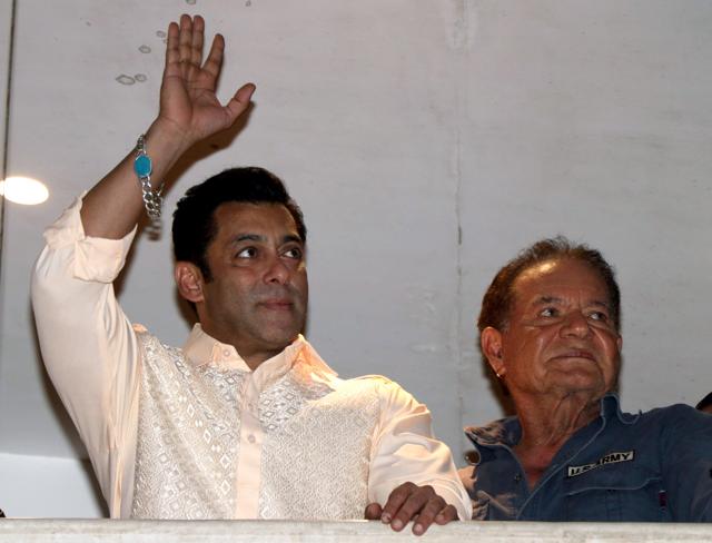 Bollywood actor Salman Khan waves to his fans as his father Salim Khan looks on, on the occasion of Eid-al-Fitr at his residence in Mumbai on Wednesday. (ANI) Bollywood actor Salman Khan waves to his fans as his father Salim Khan looks on, on the occasion of Eid-al-Fitr at his residence in Mumbai on Wednesday. (ANI)
