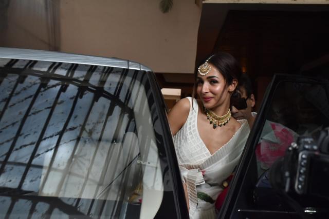 Malaika Arora smiles looking at the waiting photographers. Malaika Arora smiles looking at the waiting photographers.