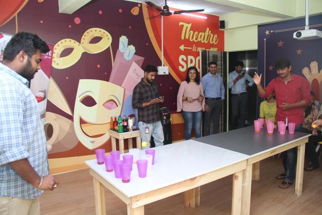 Residents play beer pong and mingle with other residents during social gatherings organized by the co-living companies, that make activities affordable and fun. (CoLive)