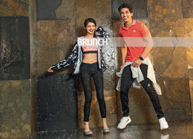 (On Radhika) Windcheater, sports bra and tights, Adidas; shoes, Crocs. (On Rajat) T-shirt, track pants, windcheater and sneakers, Adidas; watch, Fitbit Versa (Shivamm Paathak) (On Radhika) Windcheater, sports bra and tights, Adidas; shoes, Crocs. (On Rajat) T-shirt, track pants, windcheater and sneakers, Adidas; watch, Fitbit Versa (Shivamm Paathak)