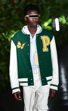 A model presents a creation for fashion house Palm Angels during the presentation of its woman's and men's spring/summer 2020 fashion collection in Milan on June 16, 2019. (Photo by Miguel MEDINA / AFP) (AFP) A model presents a creation for fashion house Palm Angels during the presentation of its woman's and men's spring/summer 2020 fashion collection in Milan on June 16, 2019. (Photo by Miguel MEDINA / AFP) (AFP)
