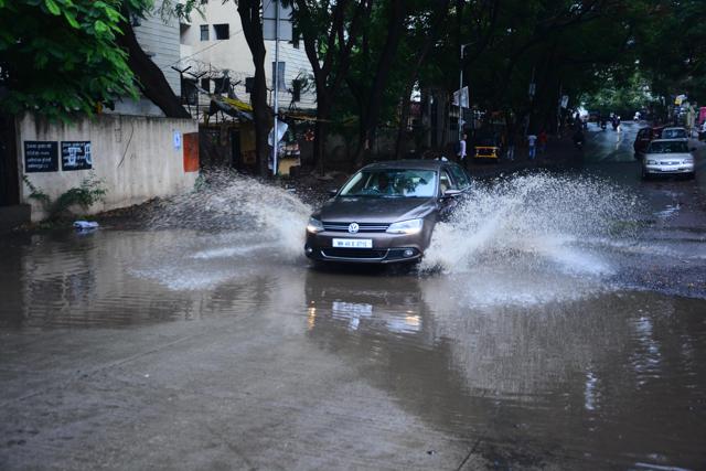 Civic issues also came to the fore, with waterlogging reported from various areas, including Rakshanagar in Kharadi (seen in picture). Several traffic jams were also reported on Monday. (Shankar Narayan/HT PHOTO)
