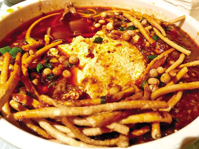 The Ma Po Tofu with fried soya bean noodles and crisp soya beans is a reminder of misal pav The Ma Po Tofu with fried soya bean noodles and crisp soya beans is a reminder of misal pav