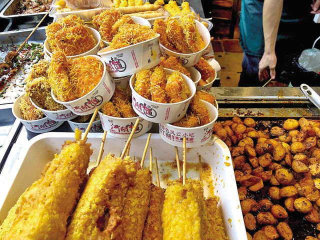 Sichuan is famous for little street snacks such as deep-fried hot dogs, egg pancakes etc Sichuan is famous for little street snacks such as deep-fried hot dogs, egg pancakes etc