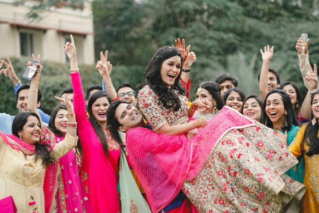 Misha Mittal, a 30-year-old businesswoman, was upset when it started raining toward the end of her mehendi ceremony. But once she saw that everyone else was having a good time dancing in the rain, she joined in the celebrations too. (Colourblind Productions) Misha Mittal, a 30-year-old businesswoman, was upset when it started raining toward the end of her mehendi ceremony. But once she saw that everyone else was having a good time dancing in the rain, she joined in the celebrations too. (Colourblind Productions)