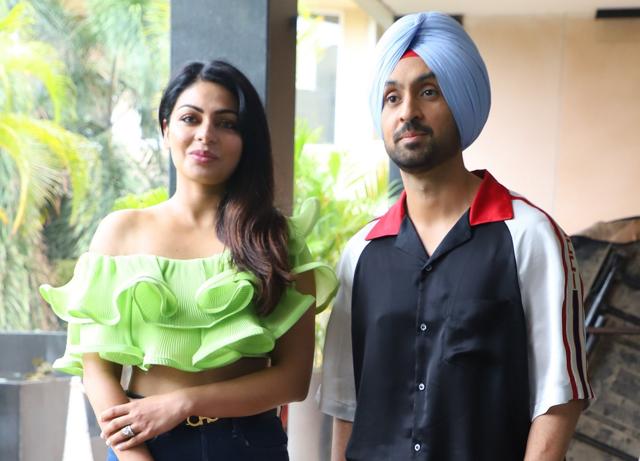 Diljit Dosanjh and Neeru Bajwa pose for pictures. (IANS) Diljit Dosanjh and Neeru Bajwa pose for pictures. (IANS)