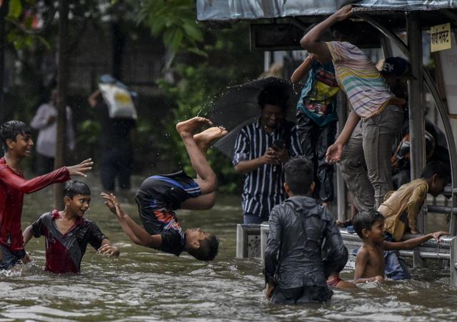 Boy jumps into the water of a flooded street after heavy rain showers at Gandhi Market, Sion in Mumbai, India, on Monday, July 1, 2019. (Kunal Patil/HT Photo) Boy jumps into the water of a flooded street after heavy rain showers at Gandhi Market, Sion in Mumbai, India, on Monday, July 1, 2019. (Kunal Patil/HT Photo)