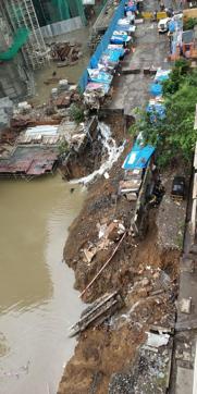 A road caved in Sangharsh Nagar in Chandivali in Powai due to incessant rainfall. Powai has registered 402 mm rain in last 24 hours. (Vijayanand Gupta / HT Photo ) A road caved in Sangharsh Nagar in Chandivali in Powai due to incessant rainfall. Powai has registered 402 mm rain in last 24 hours. (Vijayanand Gupta / HT Photo )