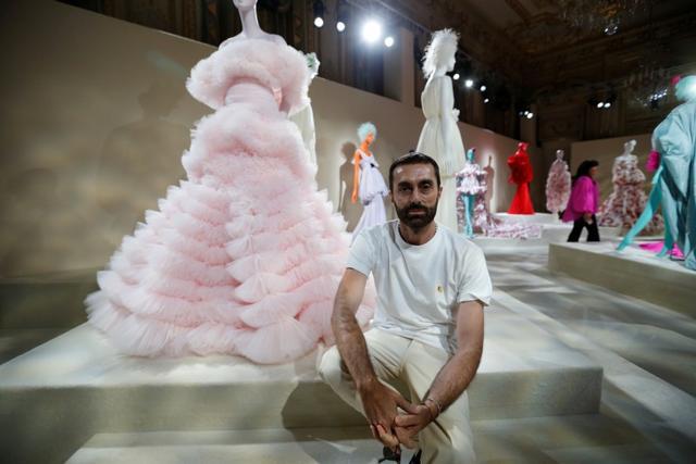 Designer Giambattista Valli poses next to creations displayed during an exhibition as part of his Haute Couture Fall/Winter 2019/20 collection presentation in Paris, France, July 1, 2019. REUTERS/Regis Duvignau (REUTERS) Designer Giambattista Valli poses next to creations displayed during an exhibition as part of his Haute Couture Fall/Winter 2019/20 collection presentation in Paris, France, July 1, 2019. REUTERS/Regis Duvignau (REUTERS)