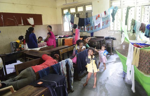 More than 1,600 people living on the Mithi river banks were evacuated after water started entering their homes. They were shifted to a BMC school in Kurla bailbazar, Tuesday, July 2, 2019. (Vijayanand Gupta/HT Photo) More than 1,600 people living on the Mithi river banks were evacuated after water started entering their homes. They were shifted to a BMC school in Kurla bailbazar, Tuesday, July 2, 2019. (Vijayanand Gupta/HT Photo)