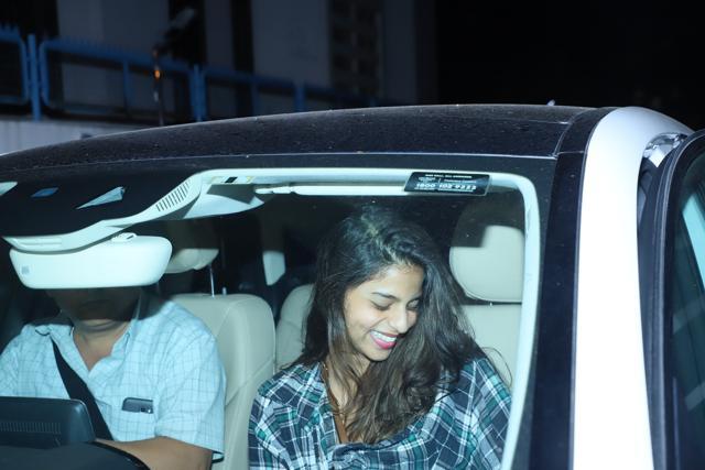 Suhana Khan laughs before getting off her car.