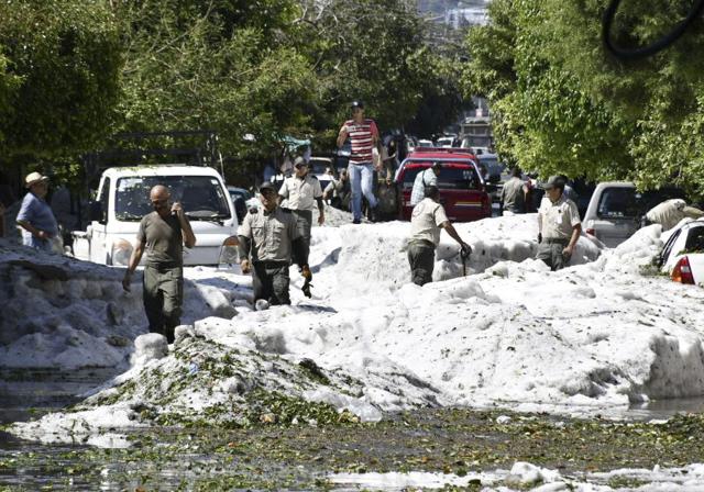 People are working to remove hail from the streets of Guadalajara, Mexico. (AP) People are working to remove hail from the streets of Guadalajara, Mexico. (AP)