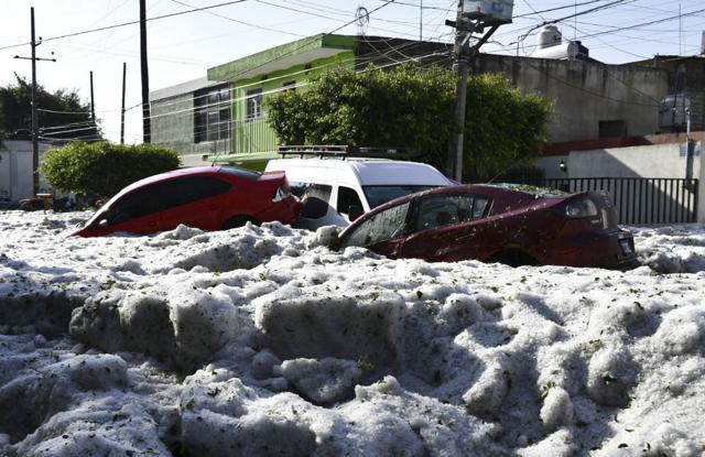 Cars are suspended in hail. (AP) Cars are suspended in hail. (AP)