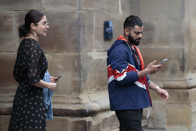 Manchester: India cricket captain Virat Kohli leaves the team hotel with his wife and Bollywood actress Anushka Sharma in Manchester city centre, the day after his team stumbled to an 18-run defeat by New Zealand at Old Trafford cricket ground in Manchester, England, Thursday, July 11, 2019. (AP) Manchester: India cricket captain Virat Kohli leaves the team hotel with his wife and Bollywood actress Anushka Sharma in Manchester city centre, the day after his team stumbled to an 18-run defeat by New Zealand at Old Trafford cricket ground in Manchester, England, Thursday, July 11, 2019. (AP)