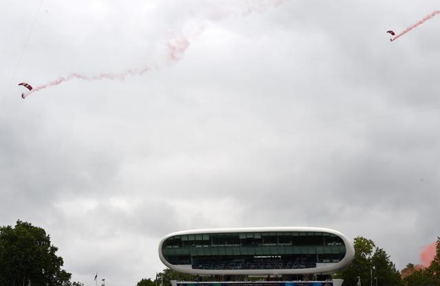 Members of the Red Devils pictured coming down on the ground at Lord’s Cricket Ground. (AFP)