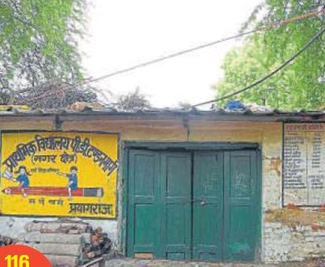 As many as 35 students of classes 1 to 5 study in this two-room government primary school on PD Tandon Road in Prayagraj. During monsoon, the overhead cable is dangerous, but no one has so far paid any attention towards it. (HT Photo ) As many as 35 students of classes 1 to 5 study in this two-room government primary school on PD Tandon Road in Prayagraj. During monsoon, the overhead cable is dangerous, but no one has so far paid any attention towards it. (HT Photo )