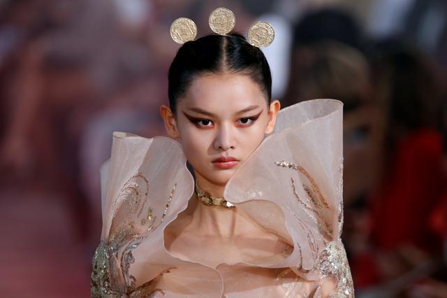A model presents a creation by designer Elie Saab as part of his Haute Couture Fall/Winter 2019/20 collection show in Paris. (REUTERS) A model presents a creation by designer Elie Saab as part of his Haute Couture Fall/Winter 2019/20 collection show in Paris. (REUTERS)