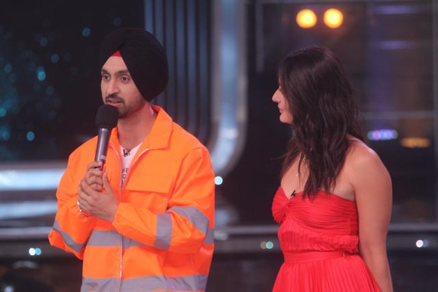 Kareena Kapoor Khan looks on as Diljit Dosanjh speaks on the sets of Dance India Dance