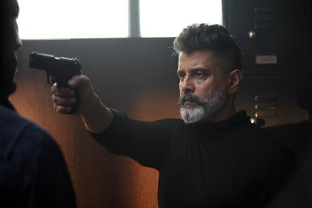 Vikram’s character speaks little but has a powerful presence. Vikram’s character speaks little but has a powerful presence.