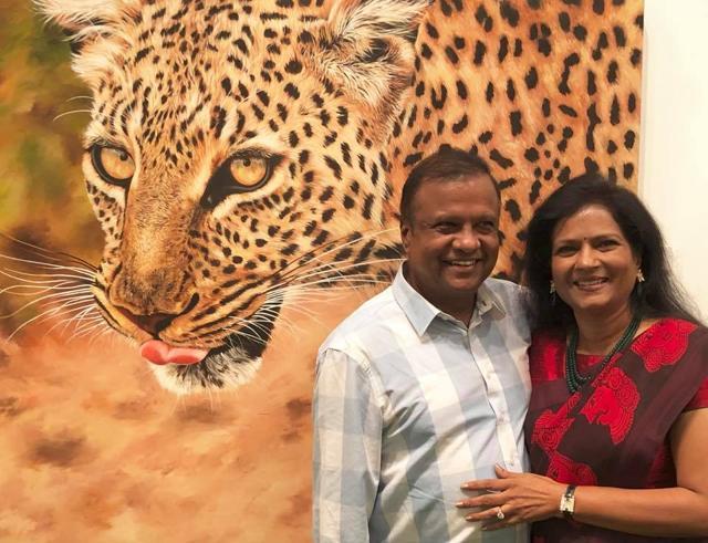 Sushma and Anand Jain with one of her canvasses.