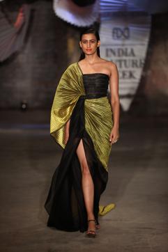 THE BOISTEROUS BRIDESMAID: A sari-style gown with a recycled polymer blouse and sheer draping is the perfect pick for the bridesmaid. (Photo: Raajessh Kashyap/HT)