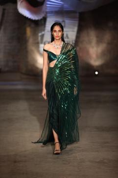 COCKTAIL SARI: The designer’s signature drapes offset with neon yellow beaded work and an (Photo: Raajessh Kashyap/HT)