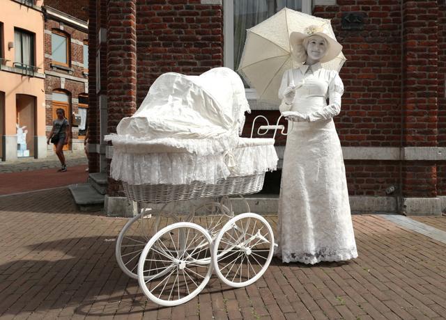 An artist called "The woman and the pram" takes part in the festival "Statues en Marche" in Marche-en-Famenne, Belgium, July 20, 2019. REUTERS/Yves Herman (REUTERS) An artist called "The woman and the pram" takes part in the festival "Statues en Marche" in Marche-en-Famenne, Belgium, July 20, 2019. REUTERS/Yves Herman (REUTERS)