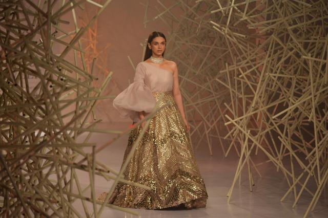 Aditi Rao Hydari presents a creation by designers Pankaj and Nidhi during the FDCI India Couture Week 2019 in Partnership with Hindustan Times in New Delhi on July 24, 2019. (AFP) Aditi Rao Hydari presents a creation by designers Pankaj and Nidhi during the FDCI India Couture Week 2019 in Partnership with Hindustan Times in New Delhi on July 24, 2019. (AFP)