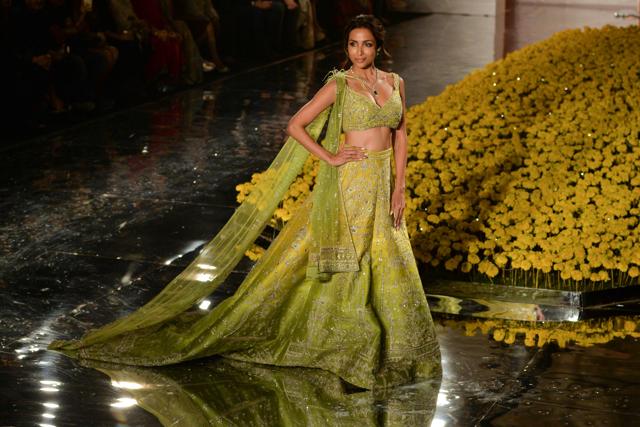 Malaika Arora presents a creation by designer Sulakshana Monga during the FDCI India Couture Week 2019 in partnership with HT. (AFP) Malaika Arora presents a creation by designer Sulakshana Monga during the FDCI India Couture Week 2019 in partnership with HT. (AFP)