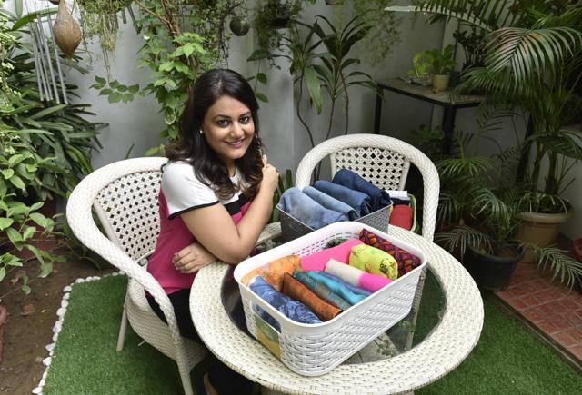Gayatri Gandhi with a few of her clothes arranged in the KonMari way. (Sanjeev Verma/HT PHOTO) Gayatri Gandhi with a few of her clothes arranged in the KonMari way. (Sanjeev Verma/HT PHOTO)