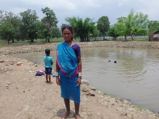 A woman from Jhiriya, another Baiga village in Mungeli district, that has managed to utilise natural spring water by routing it to farm ponds for fish farming. (HT Photo ) A woman from Jhiriya, another Baiga village in Mungeli district, that has managed to utilise natural spring water by routing it to farm ponds for fish farming. (HT Photo )