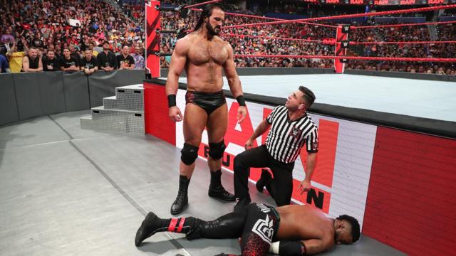 Drew McIntyre looks over his opponent after beating him down. (WWE) Drew McIntyre looks over his opponent after beating him down. (WWE)