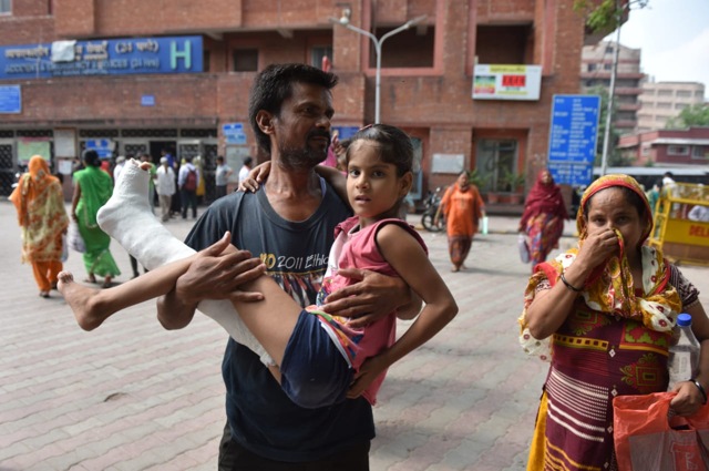 A man carries his relative at Delhi’s LNJP hospital, August 1, 2019. (Sanchit Khanna / HT Photo ) A man carries his relative at Delhi’s LNJP hospital, August 1, 2019. (Sanchit Khanna / HT Photo )
